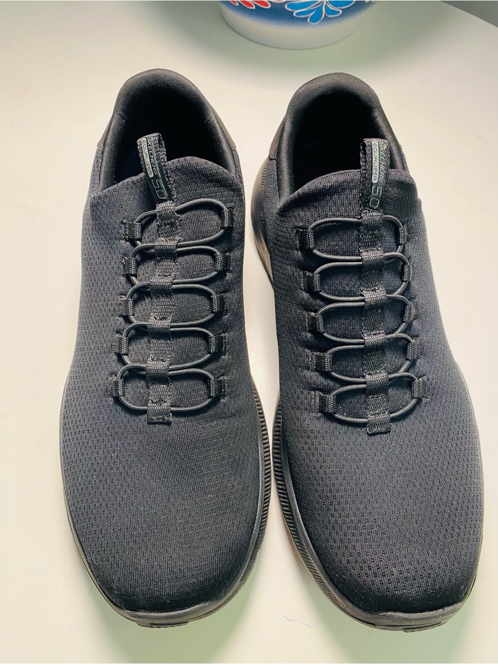 Skechers Men's Black Knit Slip-On Sneakers